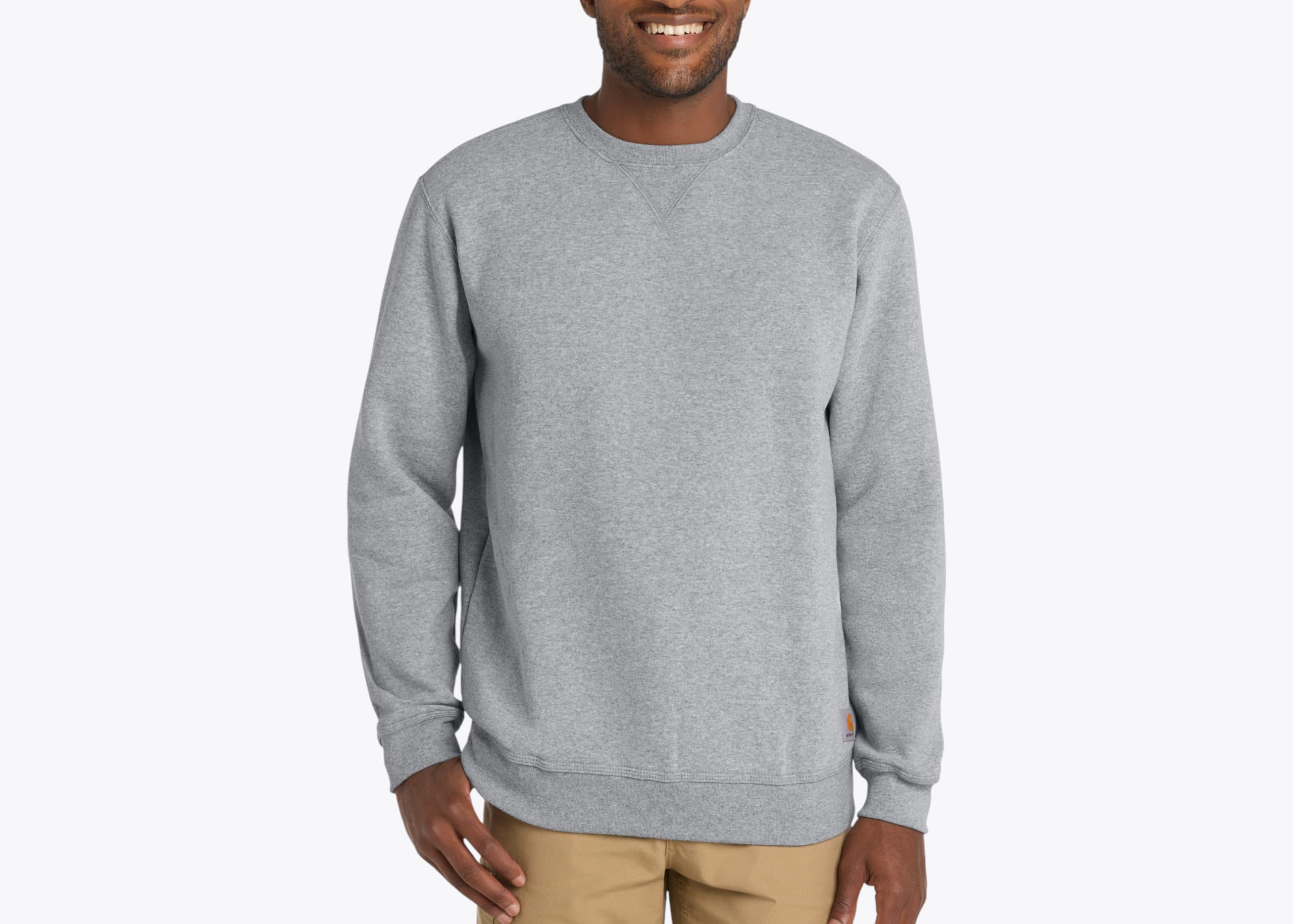 Carhartt CTK124 Midweight Crewneck Sweatshirt in Heather Grey (model:male, size:large, view:front)