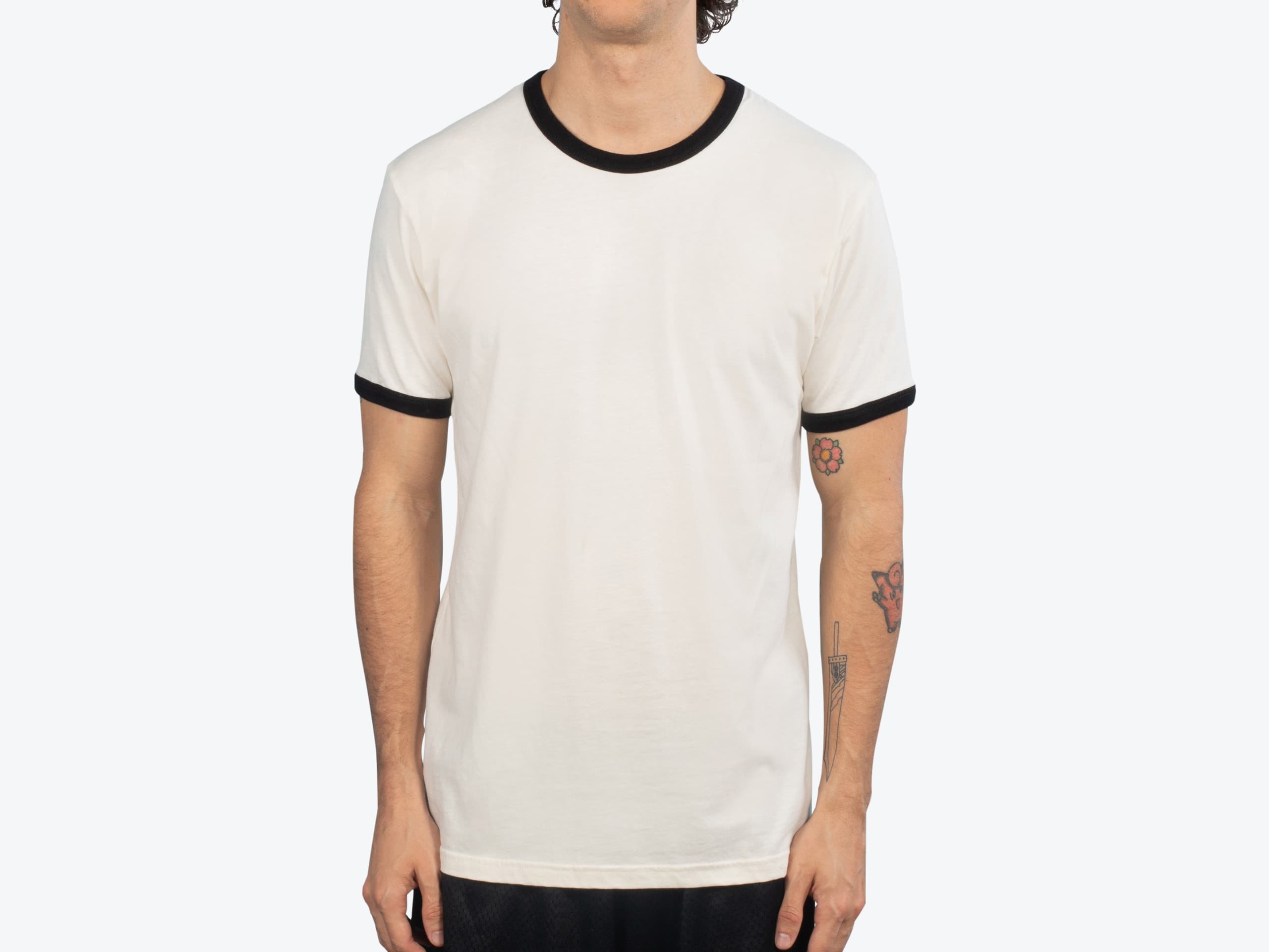 Next Level Apparel 3604 Unisex Ringer T-Shirt in Natural/Black (model:male, size:medium, view:front)